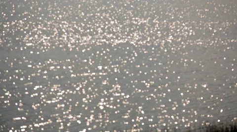 Abstract background. Bright lights shimmer and move. A refreshing lake on a s Stock Footage 61337194