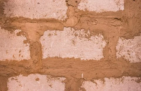 Abstract background from a brown wall made of blocks close-up. Stock Photos