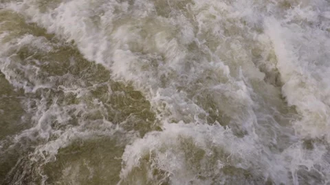 Abstract background of bubbling water cascading down a river Видео 297856644