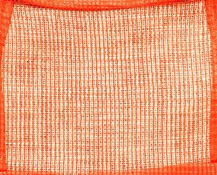 Abstract background of burlap covered with red mesh in a red frame Stock Photos