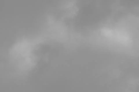Abstract background of a cloudy gray sky before a thunderstorm. Stock Photos