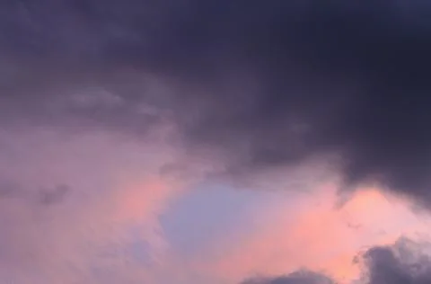 Abstract background of cloudy sunset sky blue hour. Stock Photos