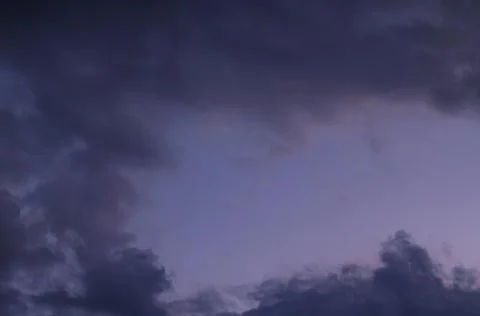 Abstract background of cloudy sunset sky blue hour. Stock Photos