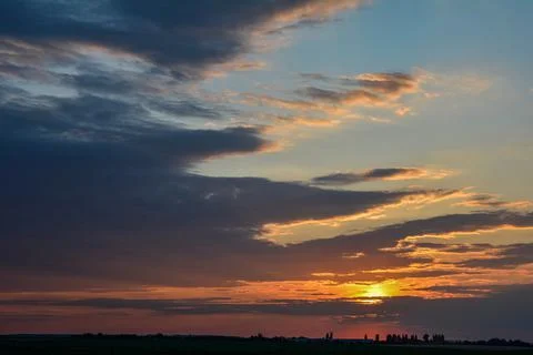 Abstract background of cloudy sunset sky golden hour Stock Photos