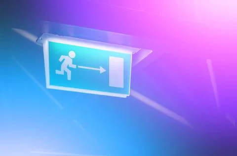 Abstract background with color gradient and blurred fire exit sign. Trendy neon Stock Photos