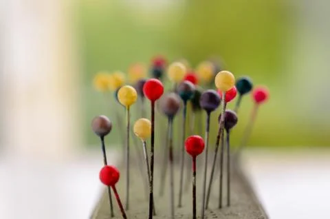 Abstract background of Colored Pins on needle case Stock Photos