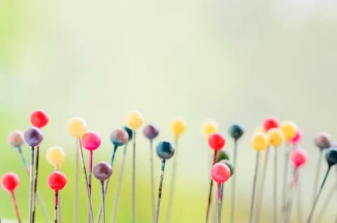 Abstract background of Colored Pins on needle case Stock Photos