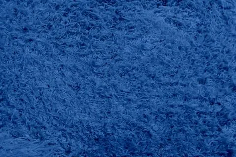 Abstract background with colored short nap. Smooth empty surface of blue colo Stock Photos