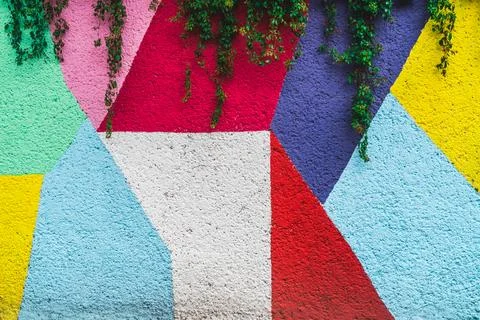 An abstract background of colorful geometric pattern in a wall Foto stock