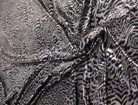 Abstract background composed of leopard print fabric. Stock Photos