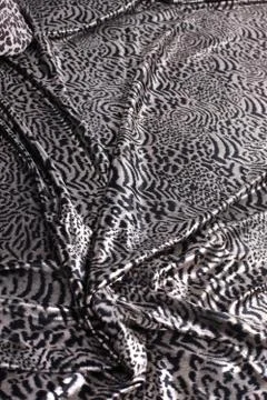 Abstract background composed of leopard print fabric. Stock Photos