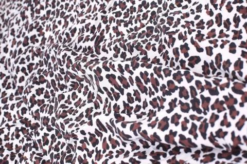 Abstract background composed of leopard print fabric. Stock Photos