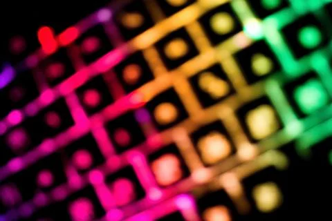 Abstract background created by blur glowing keyboard. Stock Photos