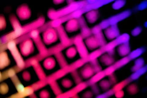 Abstract background created by blur glowing keyboard. Stock Photos