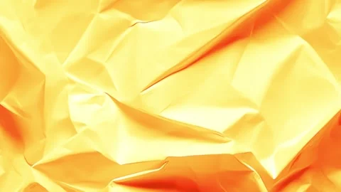 An abstract background of crumpled paper in orange tones with smooth folds 動画素材 329612345