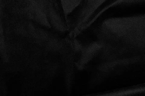 Abstract background of dark black crumpled fabric texture with elegant folds  Stock Photos