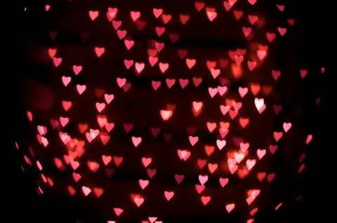 Abstract background of defocused heart-shape bokeh Stock Photos