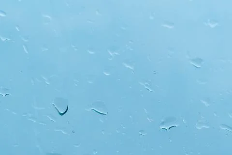 Abstract background. Drops of water on the window. water pours on a piece of Stock Photos