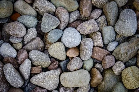 Abstract background with dry round reeble stones Stock Photos