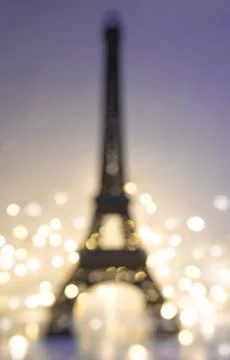 Abstract background with Eiffel tower and lights. Vertical picture, disfocuse Stock Photos