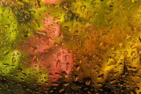 Abstract background fall, glass drops autumn yellow leaves wet october weathe Stockfoto's