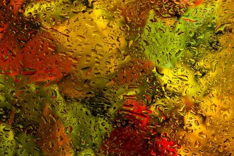Abstract background fall, glass drops autumn yellow leaves wet october weathe Stock Photos