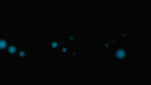 Abstract background featuring floating blue glowing bokeh particles in darkne Stock Footage 339617447