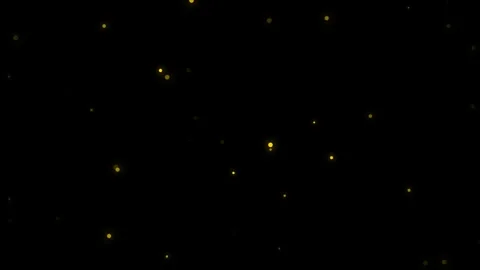 Abstract background featuring floating golden light particles on black Video stock 335117349