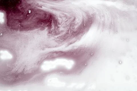 An abstract background featuring a fluid, swirling mixture of soft pink and.. Stock Photos