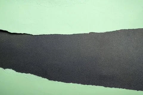 Abstract background featuring a horizontal tear in light mint green paper, .. Stock Photos