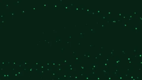 Abstract background featuring scattered glowing green particles in darkness 库存影片 335149765