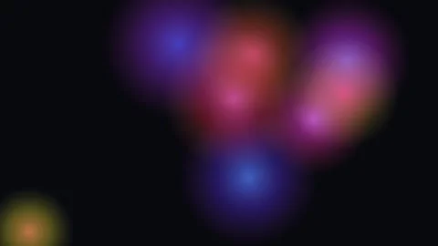 Abstract background featuring soft glowing orbs of vibrant red blue and purple 库存影片 335117120