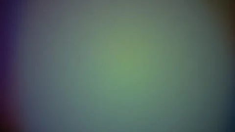 Abstract background featuring a soft gradient of muted green and dark purple Video stock 335117278