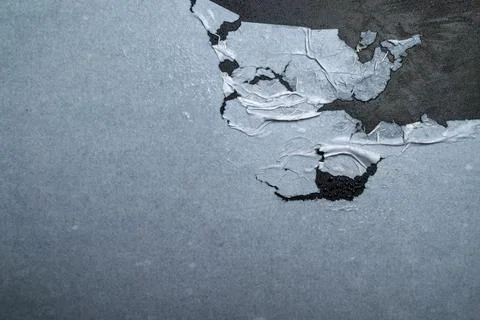 Abstract background featuring torn blue paper layers revealing a dark rough.. Stock Photos