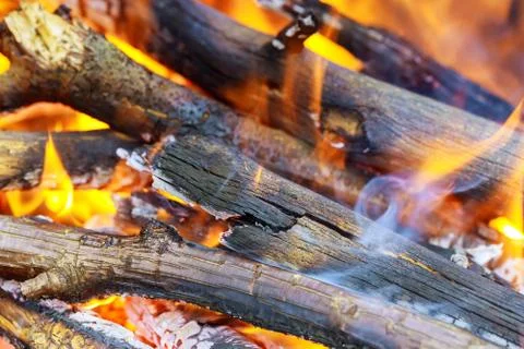 Abstract background of fire, flame and wood logs. Stock Photos