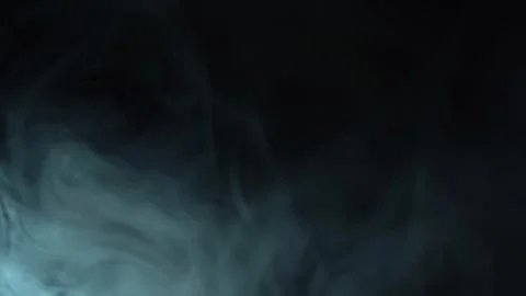 Abstract background of floating smoke isolated on black. fog on the light spot 库存影片 272171700