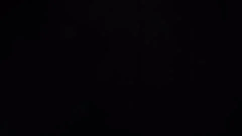 Abstract background of floating smoke isolated on black. fog on the light spot 库存影片 272171734