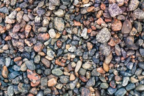 Abstract background with  floor pattern of wet sea gravel stones Stock Photos