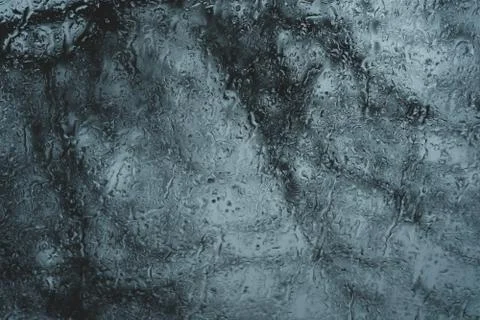 Abstract background of flowing down drops of rain on glass Stock Photos