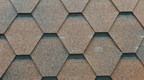 Abstract background in the form of roofing material of different shapes. Stock Photos