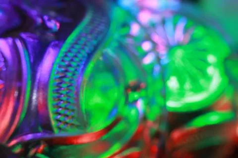 Abstract background of a glass jar with a pattern of green and blue lights Stock Photos