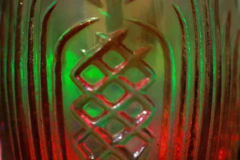 Abstract background of a glass jar with a pattern of green and red lights Stock Photos