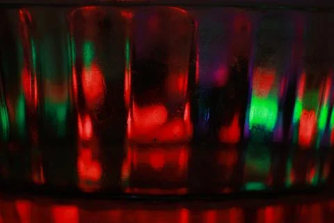 Abstract background of a glass jar with a pattern of green and red lights Stock Photos