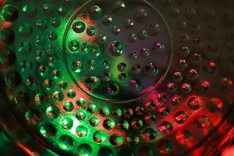 Abstract background of a glass jar with a pattern of green and red lights Stock Photos