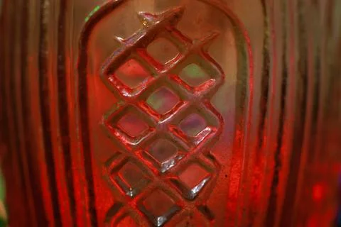 Abstract background of a glass jar with a pattern of green and red lights Stock Photos