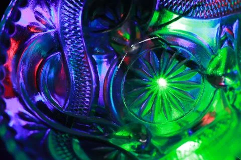 Abstract background of a glass jar with a pattern of green and blue lights Stock Photos