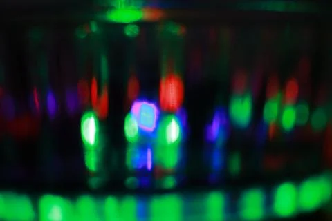 Abstract background of a glass jar with a pattern of green and red lights Stock Photos