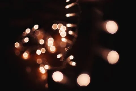 Abstract background with glowing blurred lights in dark space and bokeh effec 스톡 사진