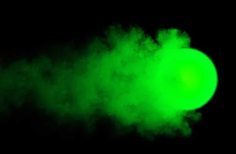 Abstract background, glowing burning green ball with clouds and smoke on black Stock Illustration