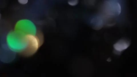 Abstract background of glowing colored bokeh lights with slow motion upwards. Видео 318577296